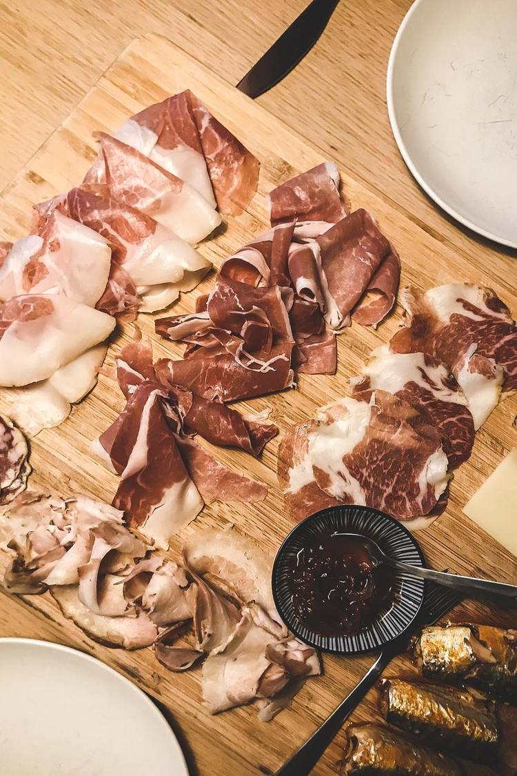 Charcuterie Recipe - Charcuterie Board of Assorted Prosciutto, Salami and Hams with Chutney