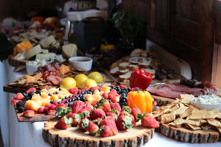 Assortment of Fresh Berries, Cheese, Peppers and Salami on a Grazing Table - Charcuterie Recipe
