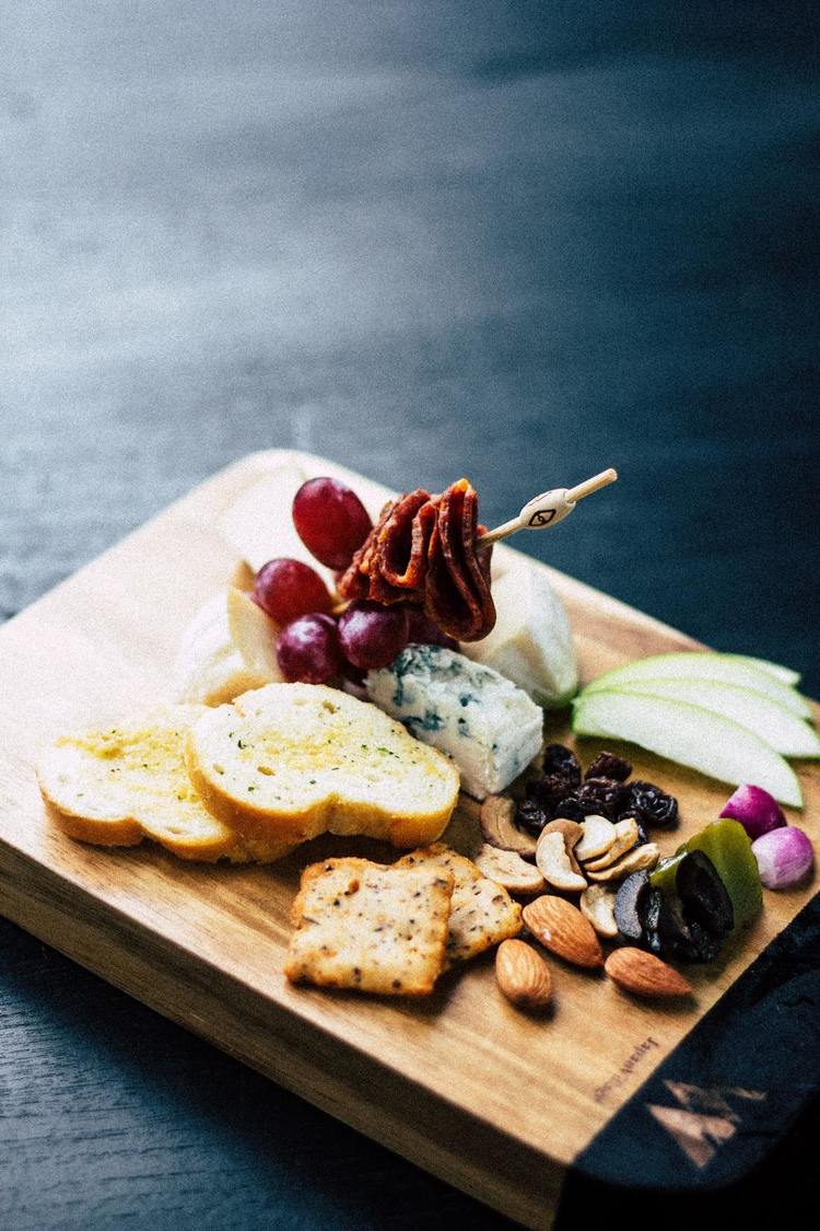 Charcuterie Board with Almonds, Grapes, Raisins, Blue Cheese, Pears and Salami
