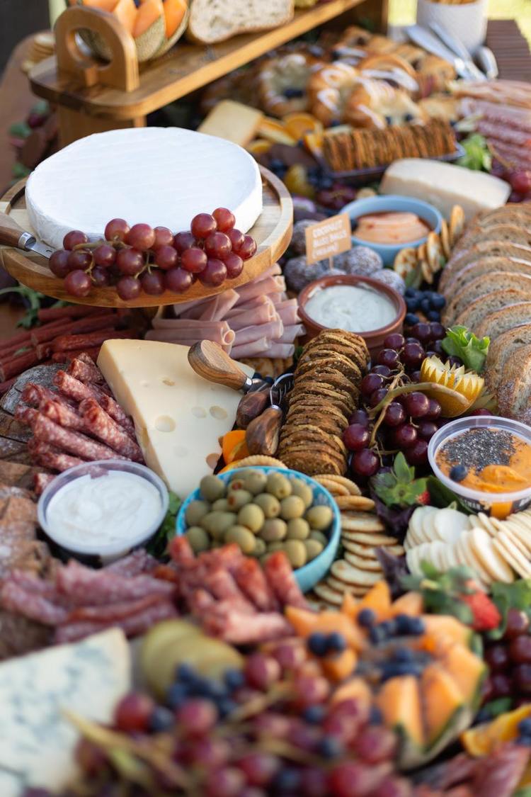 Charcuterie Recipe - Cheese and Fruits Grazing Table with Olives, Cantaloupe, Salami and Hummus