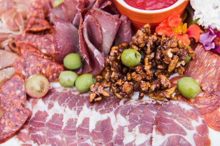 Prosciutto Charcuterie Board with Cured Meats, Olives and Roasted Walnuts Recipe