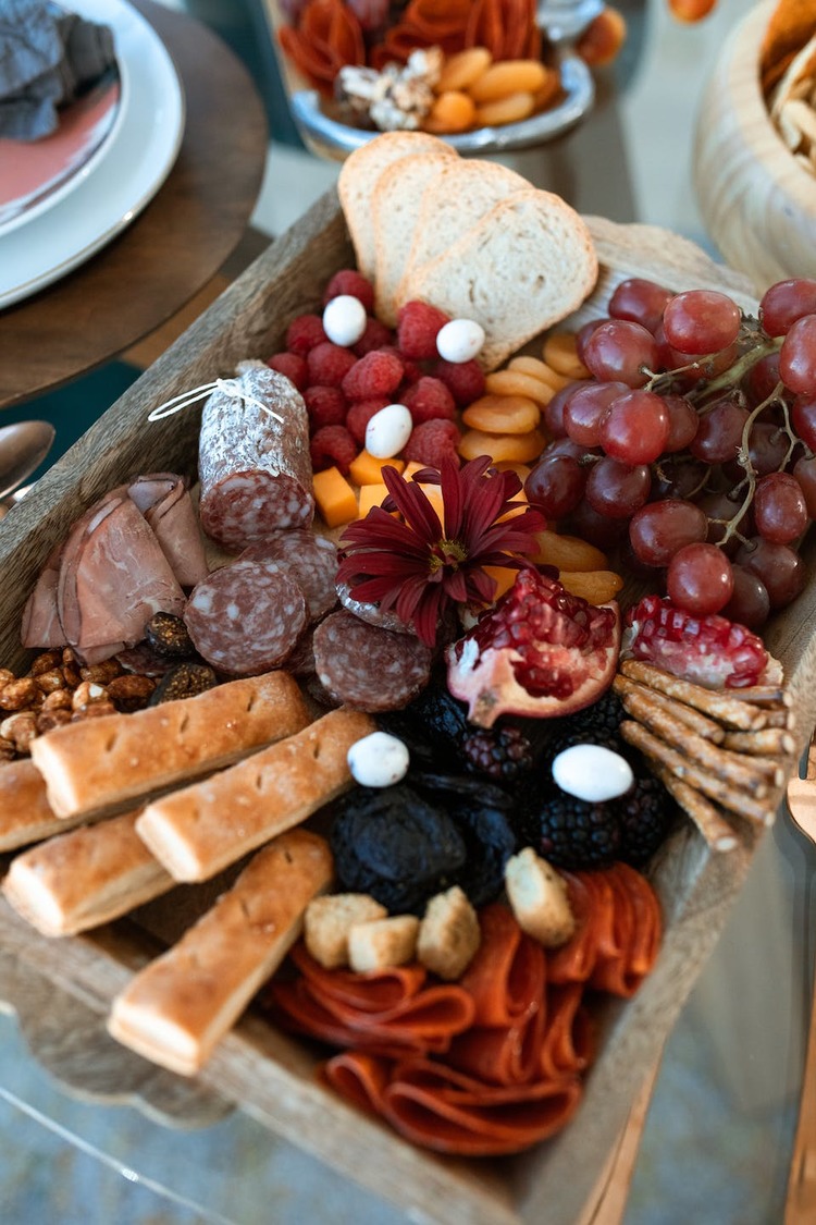 Charcuterie Recipe - Grazing Board with Breadsticks, Grapes, Salami, Cheddar Cheese and Raspberries