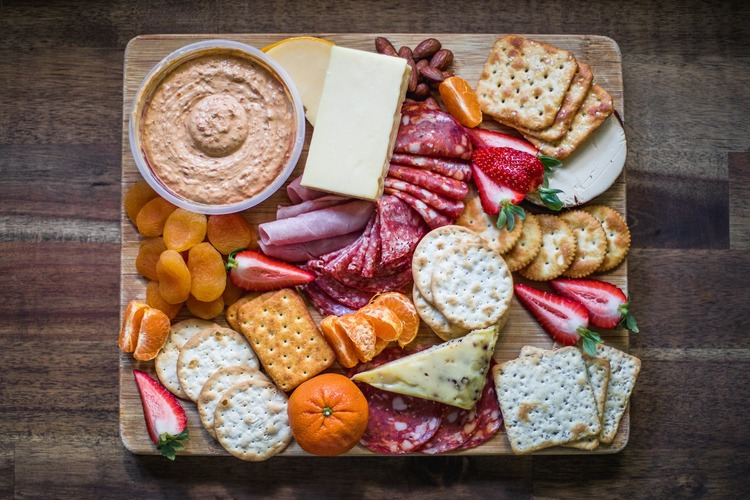 Charcuterie Recipe - Cheese and Crackers Grazing Board with Hummus, Almonds, Strawberries and Salami