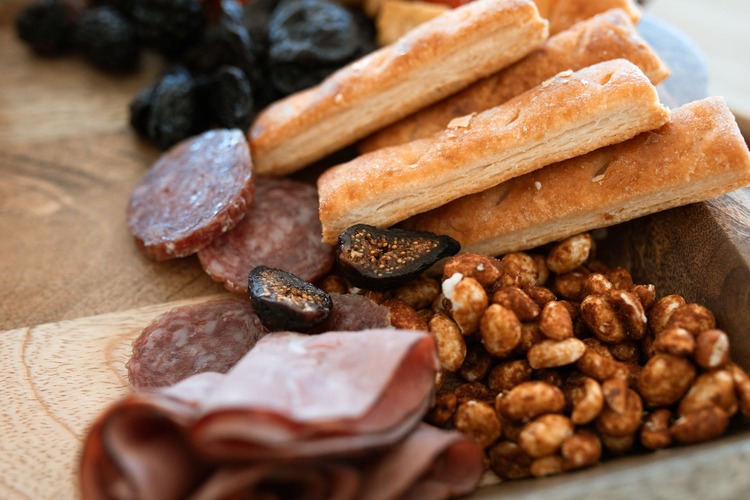 Grazing Board with Figs, Salami, Bread Sticks and Roasted Peanuts - Charcuterie Recipe