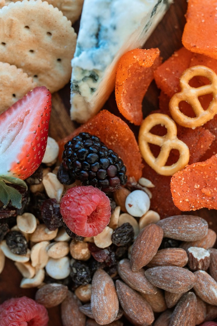 Grazing Board with Mixed Berries, Raisins, Almonds, Pretzels and Blue Cheese
