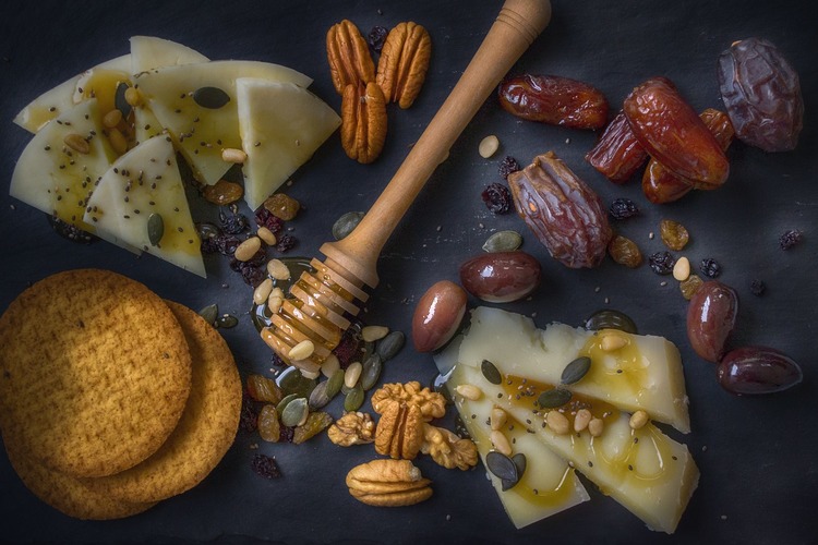 Charcuterie Recipe - Olives, Cheese, Dates, Pecans, Walnuts and Pumpkin Seed Charcuterie with Honey