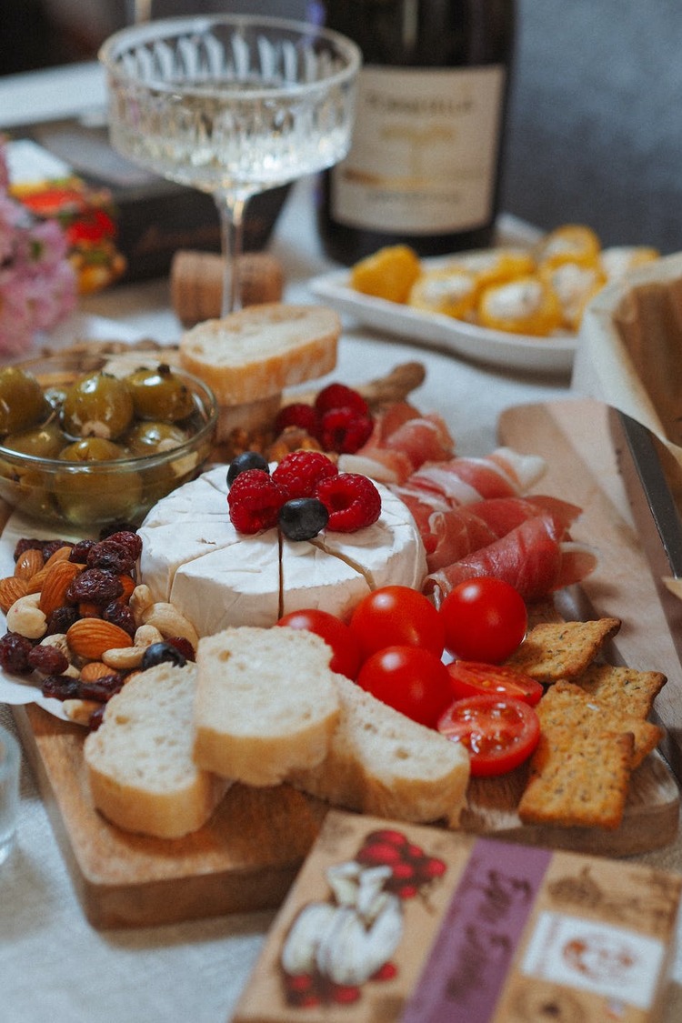 Charcuterie Recipe - Cherry Tomatoes, Prosciutto, Camembert, Fresh Berries and Nuts Charcuterie Board